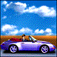 Gif animation of little silver sports car driving along on a cloudy day
