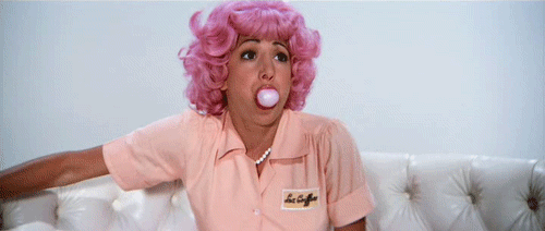 bubble blowing girl in pink