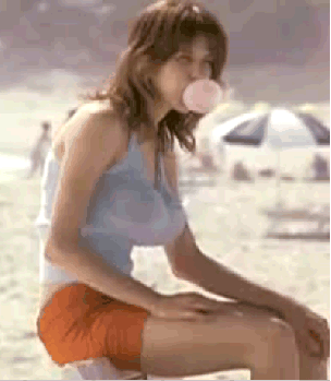 Girl hyperventilating on bubble gum at the beach