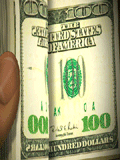 Flipping through a stack of hundred dollar bills