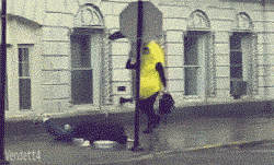 Animated banana walking along slips on a person on the ground