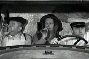 Motion picture gif animation image of The Three Stooges  bobbing heads in a car to the beat of the song "What is love"
